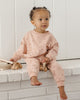 Baby wearing the Hearts Sweatpant, lifestyle photo