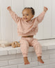Baby wearing the Hearts Sweatshirt, lifestyle photo