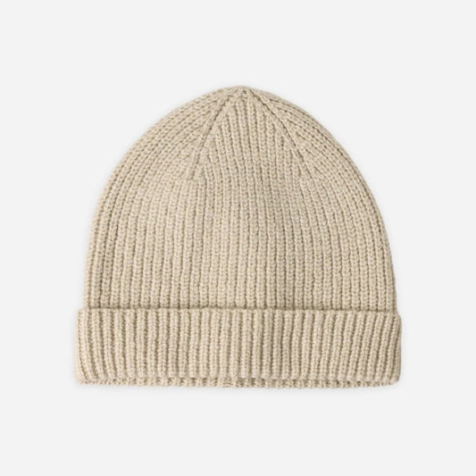 A light beige ribbed knit beanie hat centered on a plain light gray background.