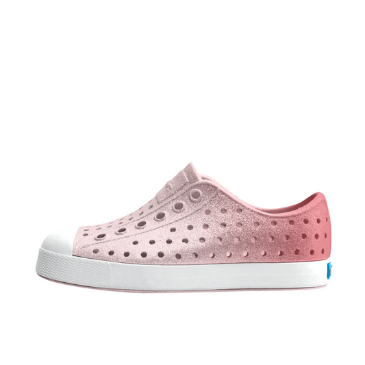 Pink shoe with white sole on a white background