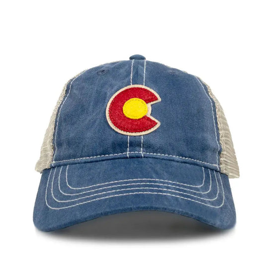 Blue denim cap with a Colorado flag logo on a white background