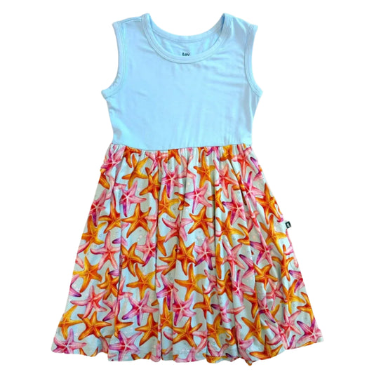 Dress with a light blue top and colorful starfish pattern skirt on a white background