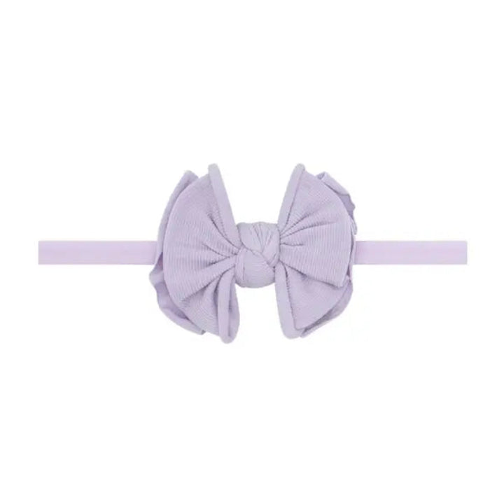 Light purple headband with bow in center
