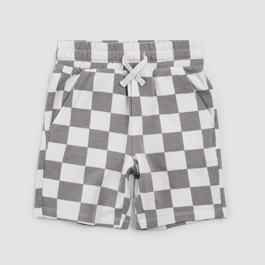 Checkered shorts with a white drawstring on a light gray background