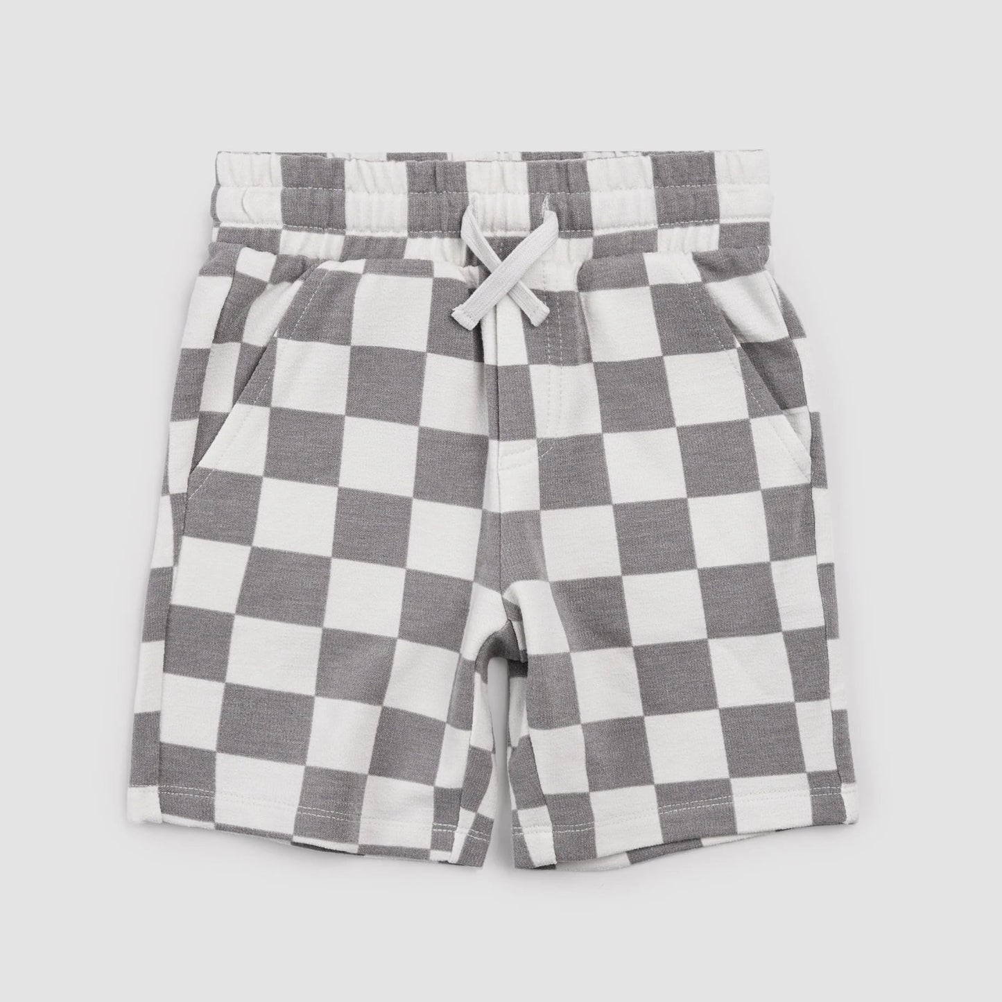 Checkered shorts with a white drawstring on a light gray background