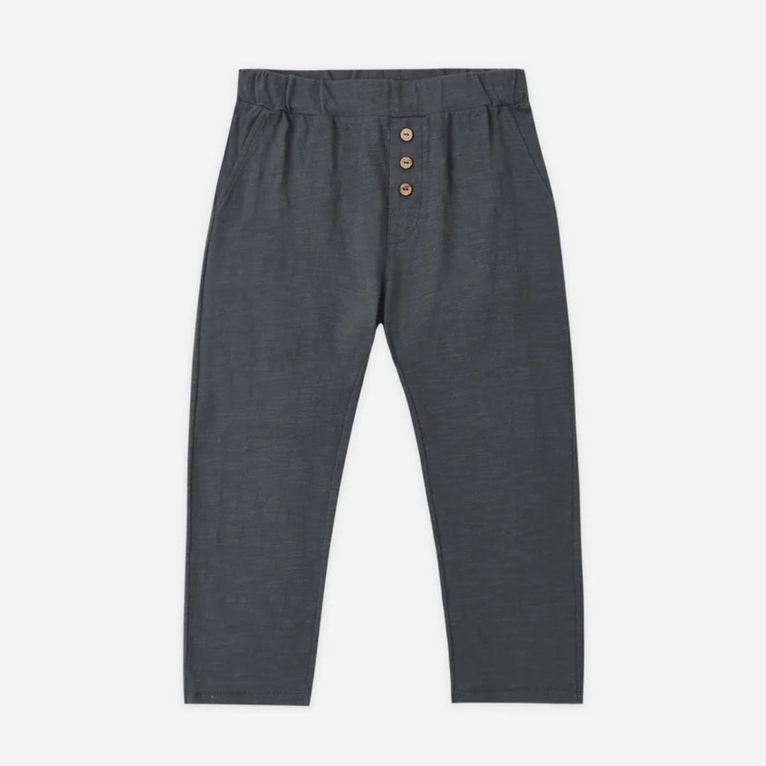 Dark gray pants with button details on a white background