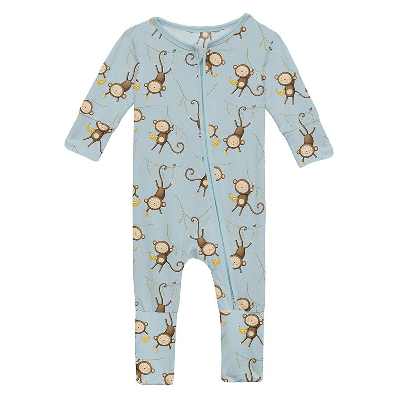 Baby zip footie with monkey pattern on a light blue background
