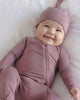 Baby wearing the Mulberry Bamboo Zip Footie, lifestyle photo
