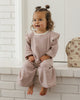 Baby wearing the Mulberry Stripe Ruffle Cozy Set, lifestyle photo
