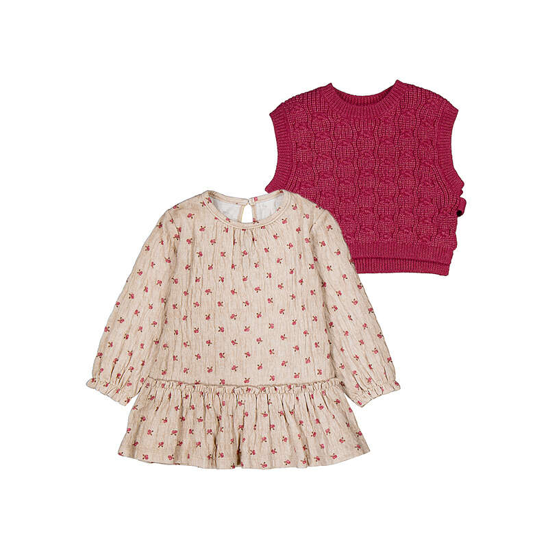 Two children's outfits shown on a plain white background: a long-sleeve cream dress with a small red floral print and ruffled hem, paired with a sleeveless magenta knit vest behind it.