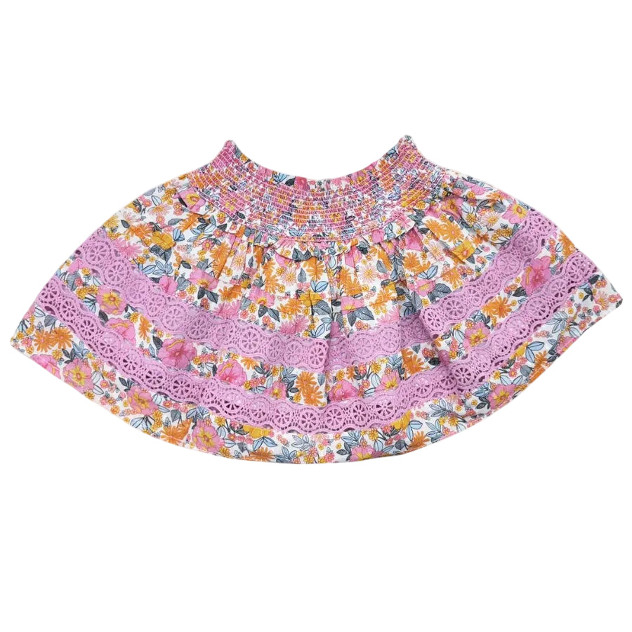 Floral skirt with pink lace trim on a white background