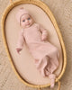 Baby wearing the Rose Microstripe Gown + Hat by Quincy Mae