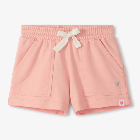 Apricot shorts with a white bow on a light gray background