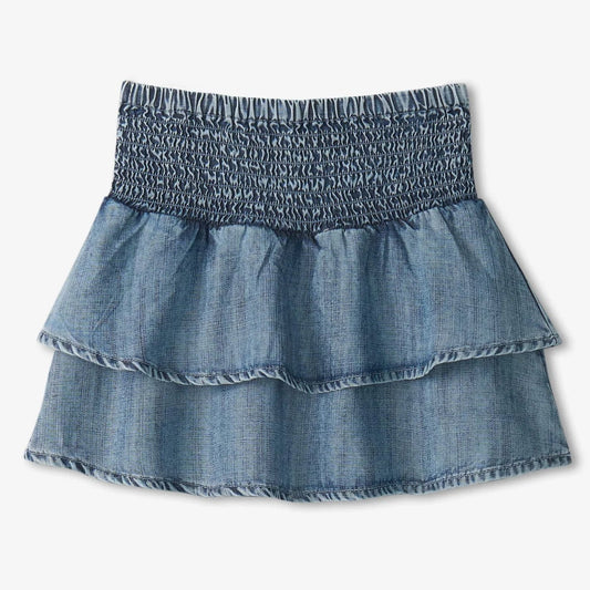 Blue denim skirt with smocked waistband on a white background