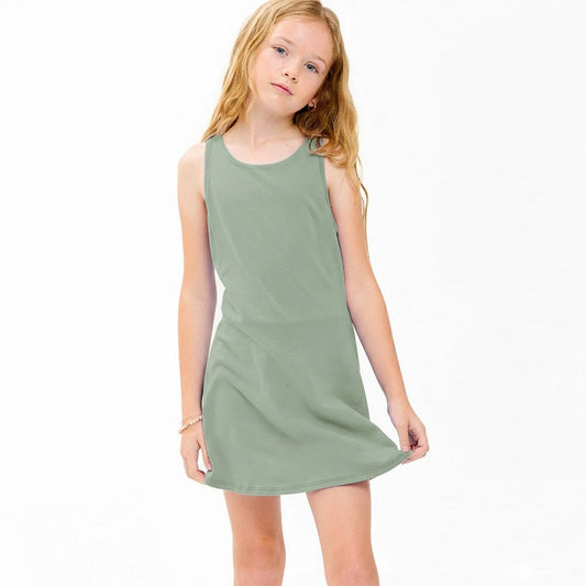 Young girl wearing a green dress on a white background