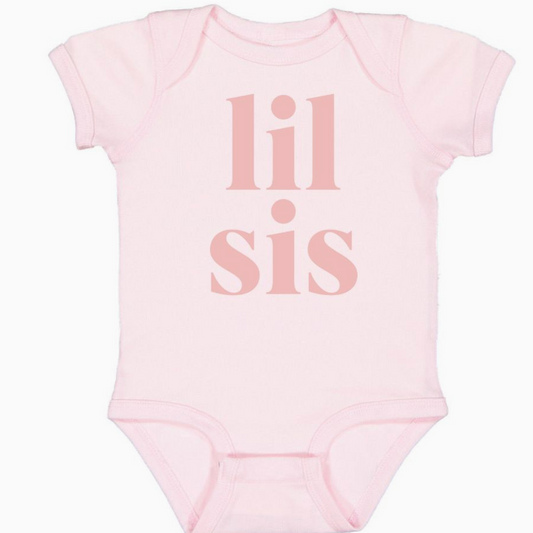 A ballet pink short sleeve bodysuit with the text 'Lil Sis' printed in dusty rose color on the front.