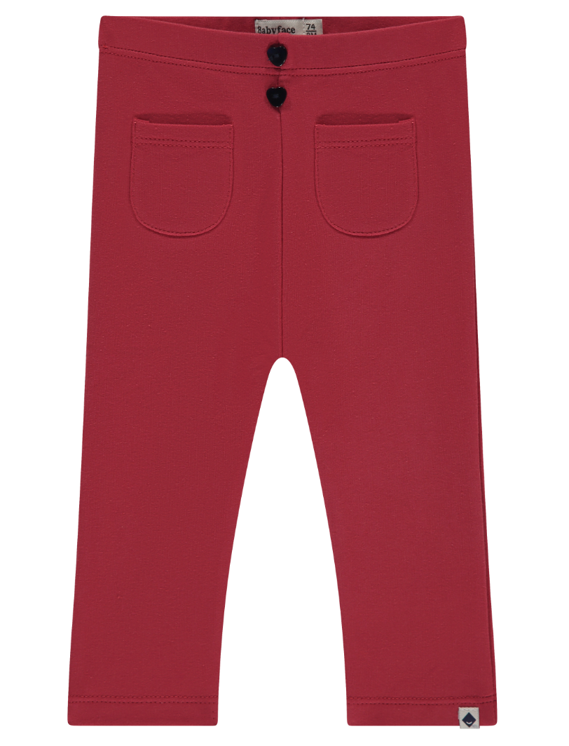 Scarlet red front pocket pants for baby girls, with a button closure and a tag visible on the side.