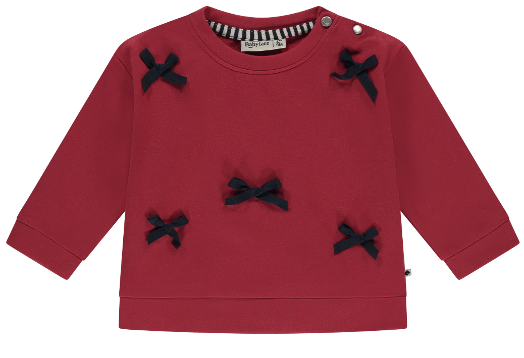 A red sweatshirt with petite grosgrain bows on it, designed for baby girls.