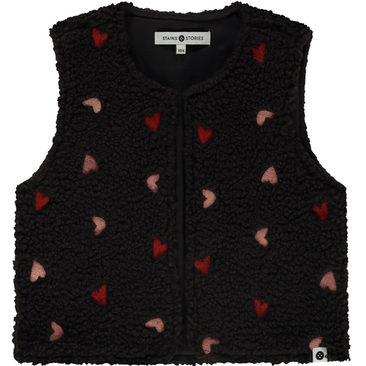 A black fleece vest for girls with embroidered red and pink hearts on the front.