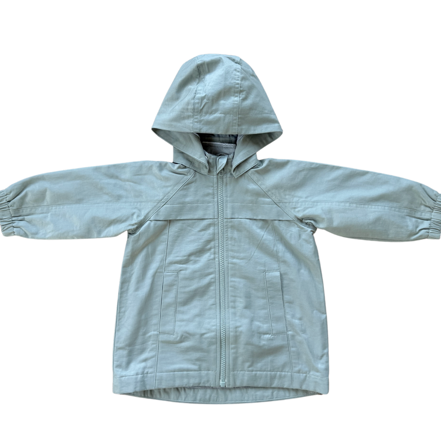 Light aqua children's raincoat with a hood on a white background