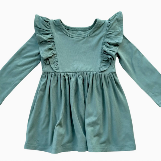 Green dress with ruffled shoulders on a white background