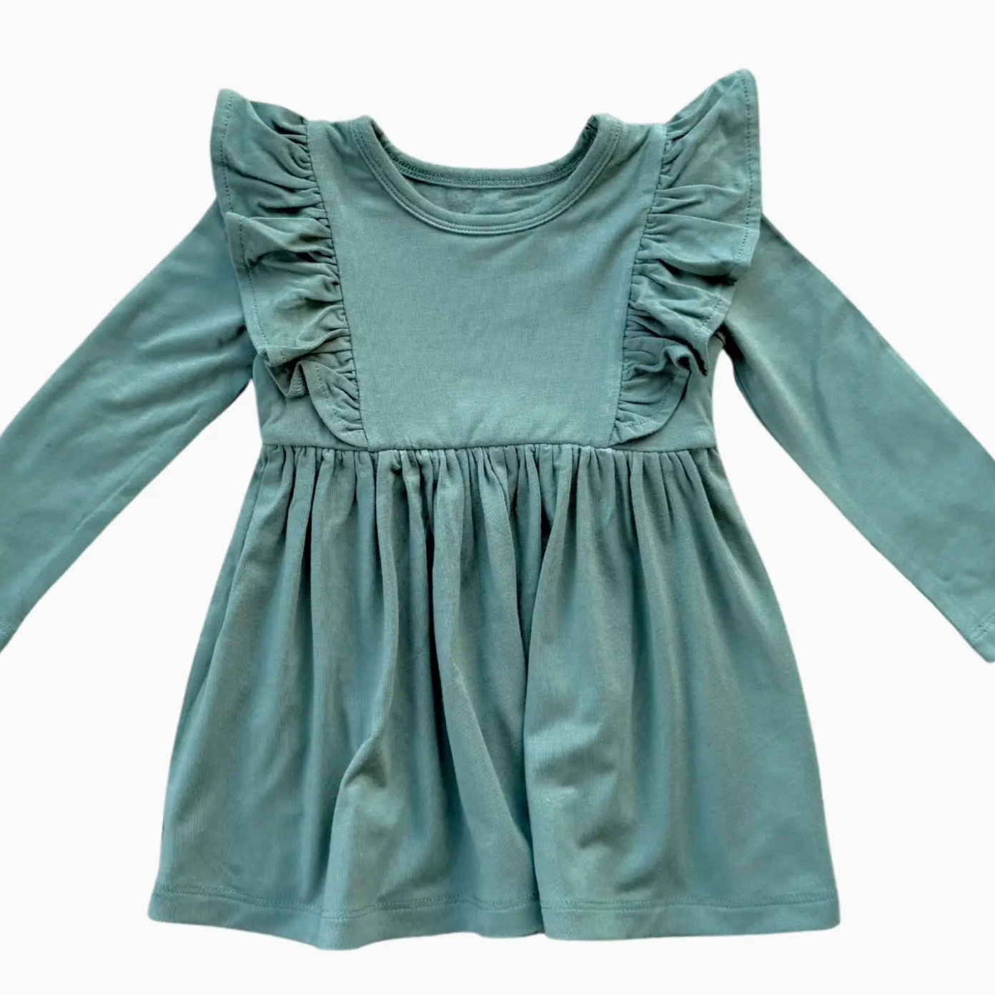 Green dress with ruffled shoulders on a white background