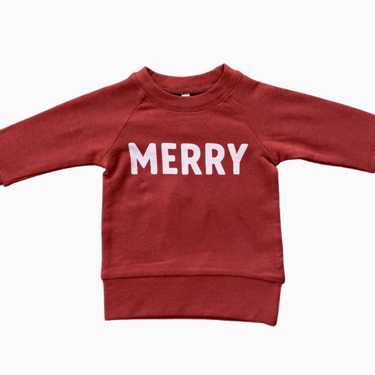 Red sweatshirt with 'MERRY' text on a white background