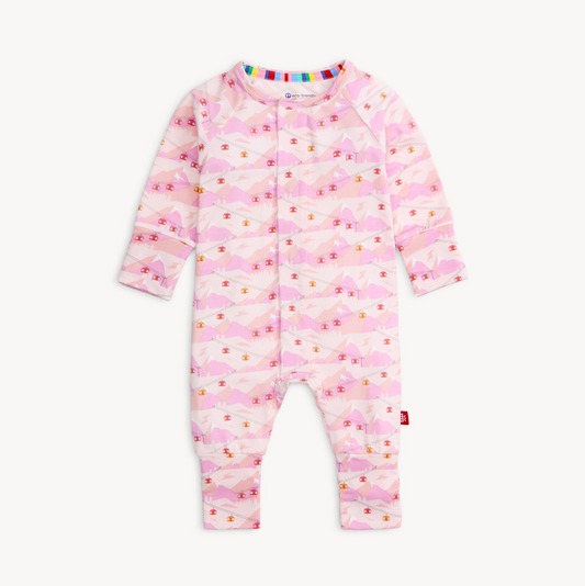 Pink baby onesie with cloud pattern on a white background