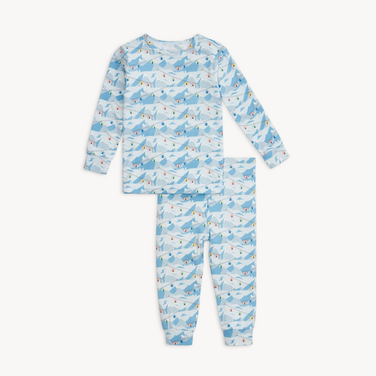 Children's pajama set with airplane pattern on a white background