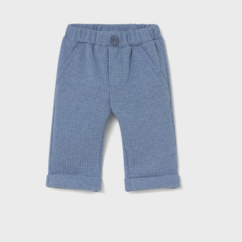 Blue checkered baby pants on a light gray background
