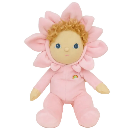 Pink plush toy with flower design on a brown background