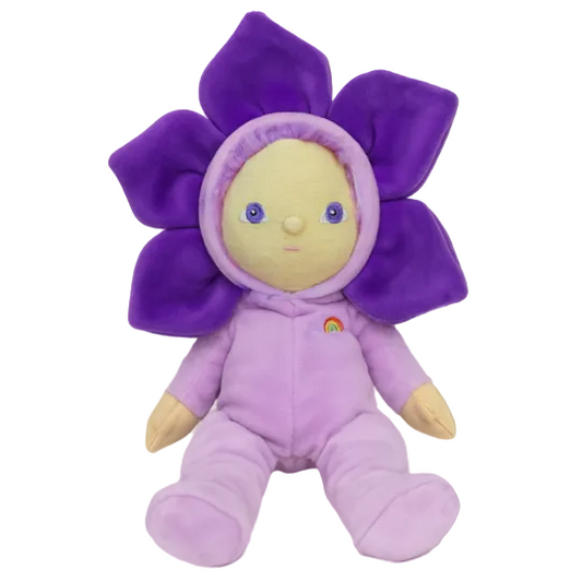 Purple flower-shaped plush toy with a face on a brown background