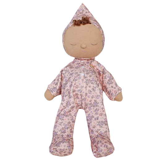 Stuffed doll with floral pattern on a plain background