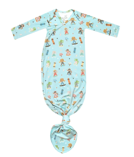 Baby swaddle with teddy bear pattern on a light blue background