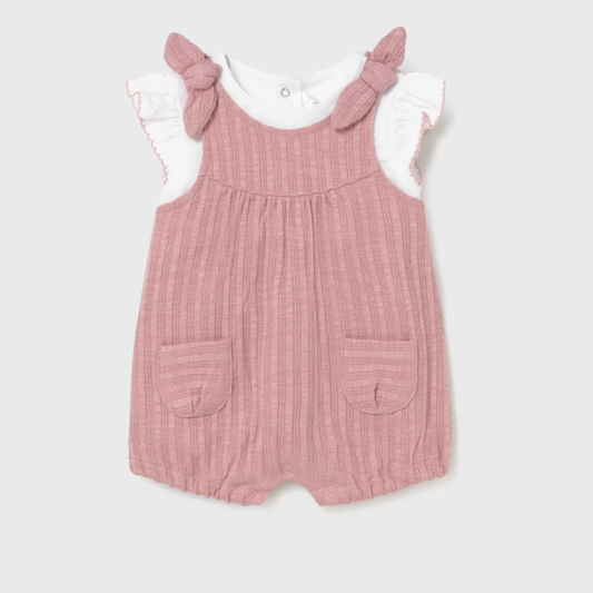 Pink romper with ruffled sleeves on a white background