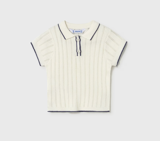 White pointelle knit polo shirt with black trim on a light gray background