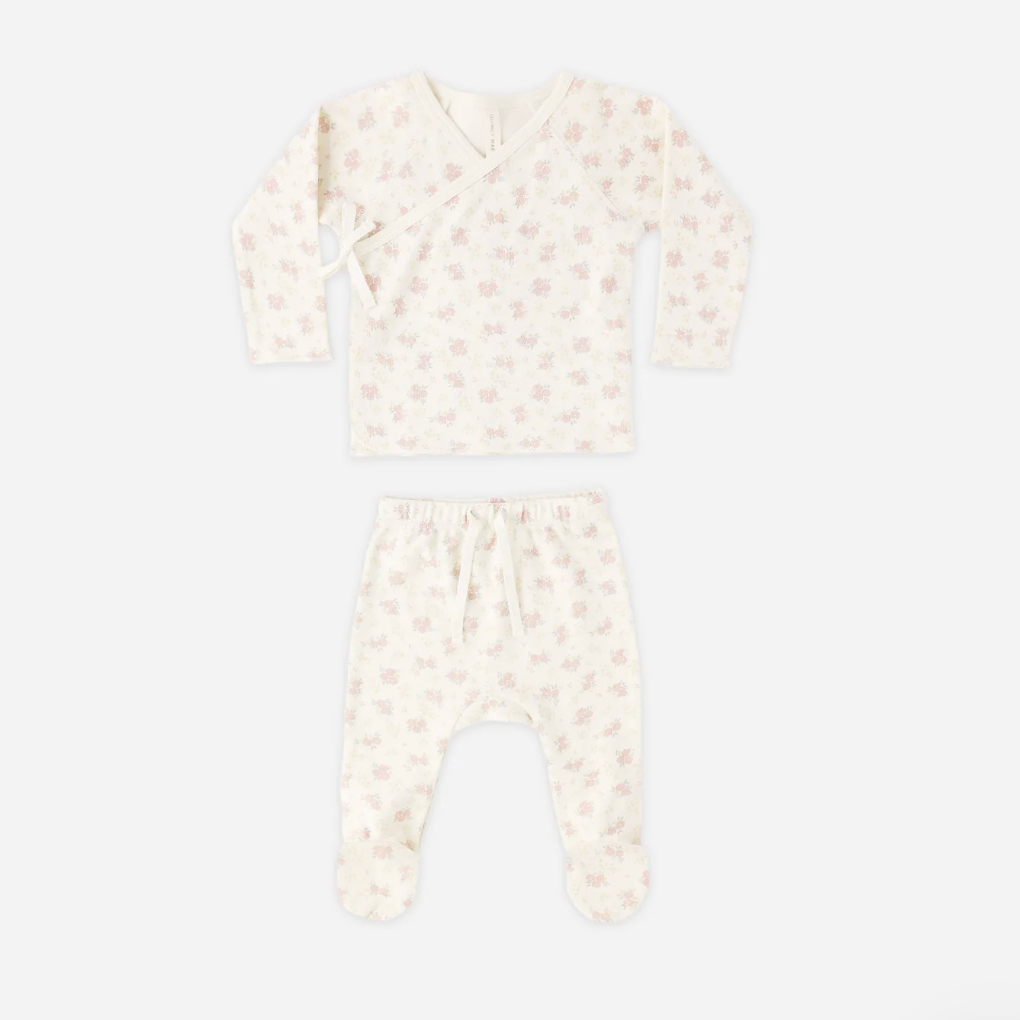 Baby outfit with long-sleeve top and pants on a white background