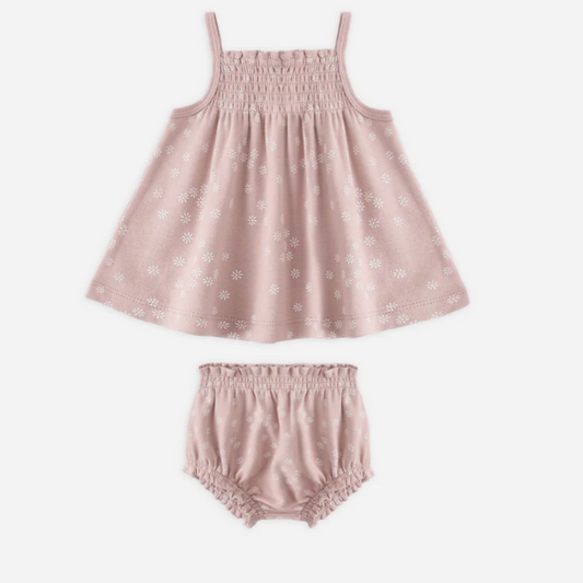 Pink baby dress and bloomers set on a white background
