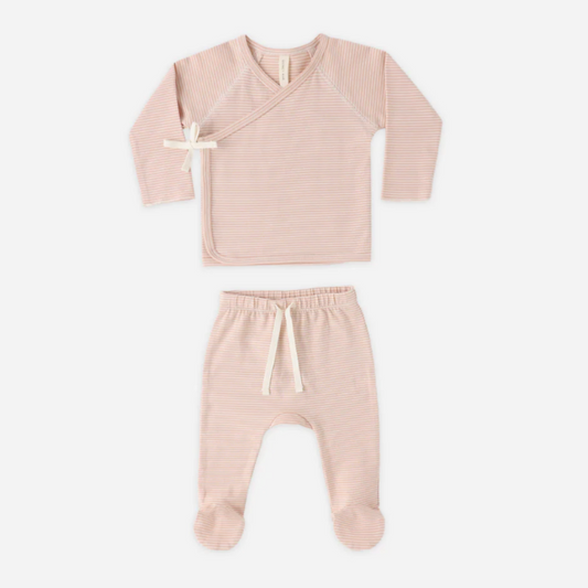 Pink baby outfit with top and pants on a white background