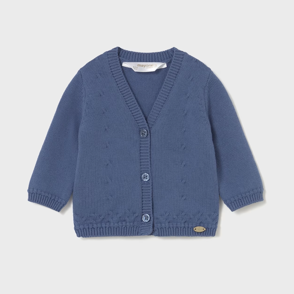 Blue knitted cardigan on a light gray background