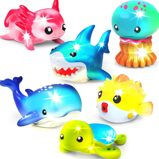 Colorful bath toys shaped like marine animals on a white background