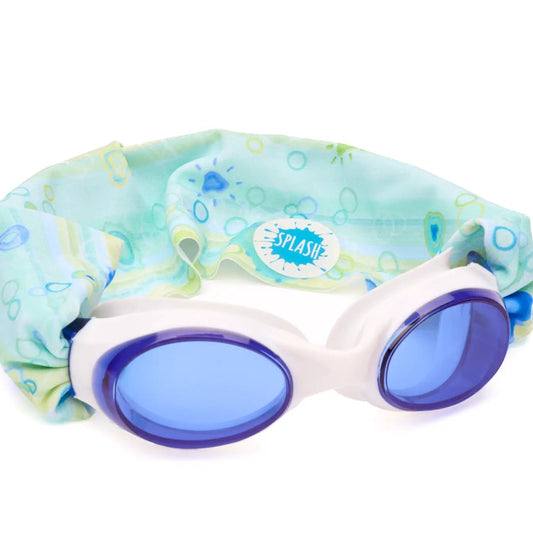 A pair of swim goggles with blue lenses, white frame, and a strap featuring a light pink and peach butterfly pattern.