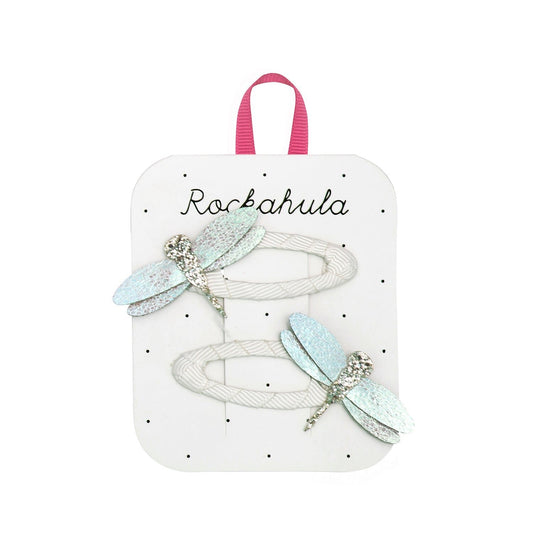 Packaged hair accessories with dragonfly designs on a Rockahula branded card.