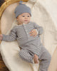 Baby wearing the Slate Microstripe Ribbed Romper, lifestyle photo