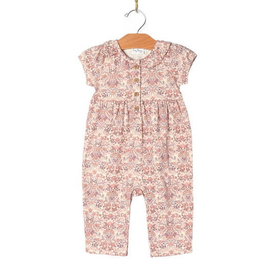 Floral-patterned baby romper on a hanger