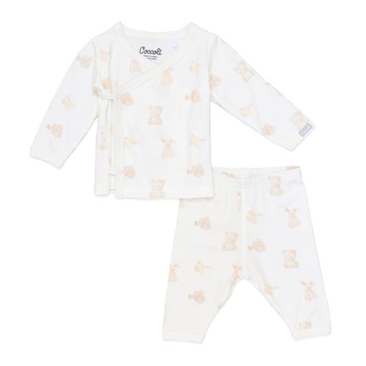 Baby outfit with long-sleeve top and pants featuring a pattern on a white background