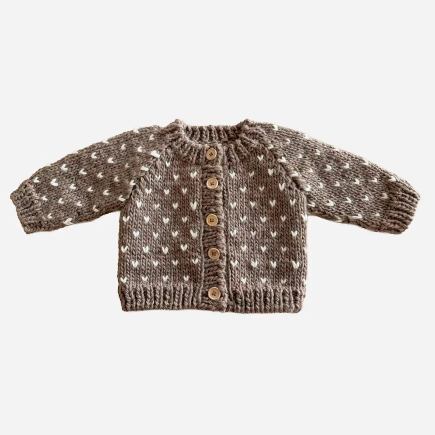 Knitted sweater with heart pattern on a white background