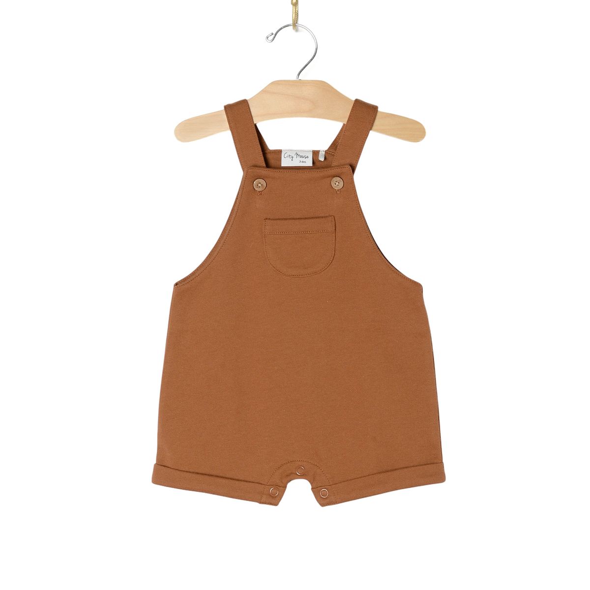 Brown children's overalls on a hanger