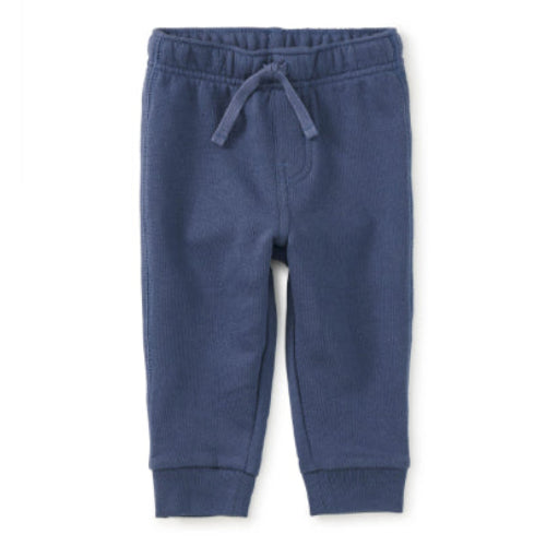 Blue children's jogger pants on a white background