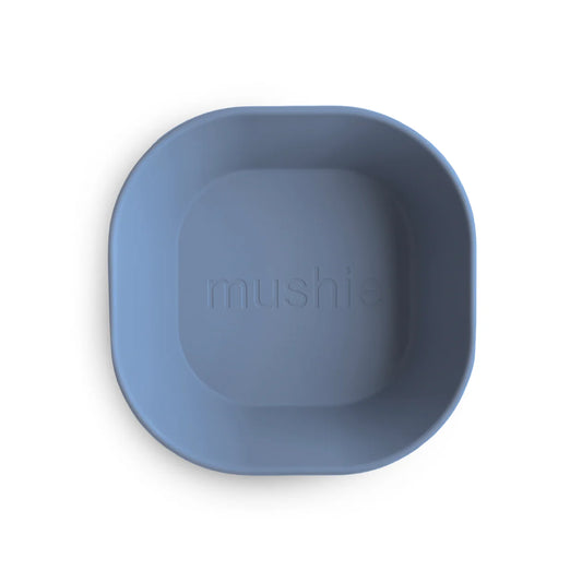 Blue bowl with 'mushie' branding on a white background